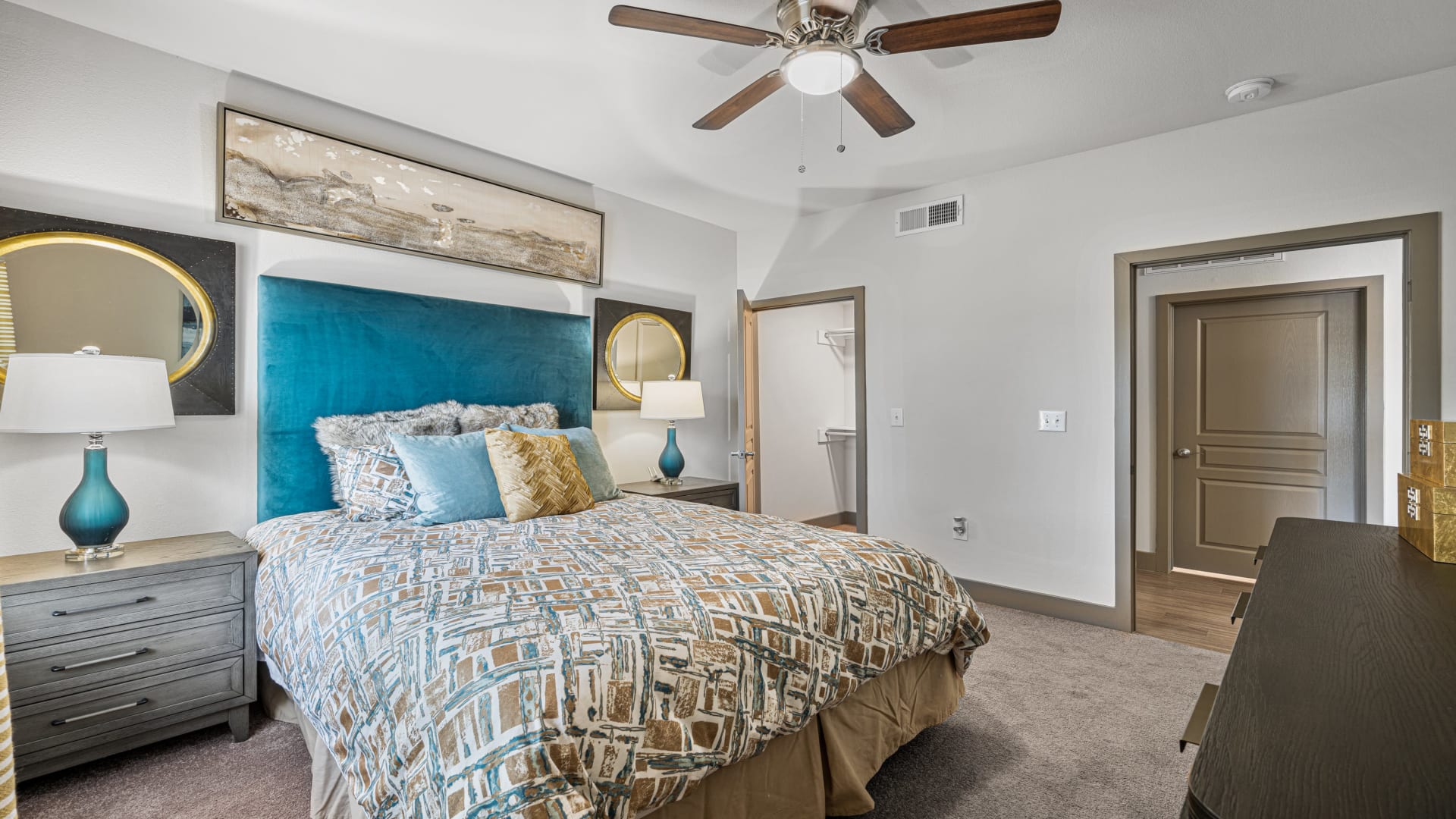 a bedroom with a ceiling fan and a bed at The Panr Hollow