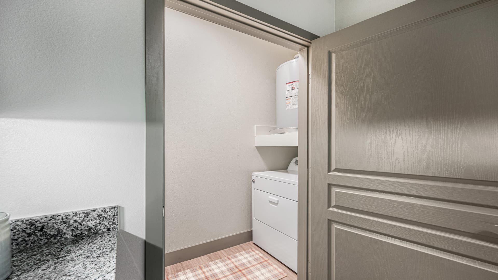 a laundry room with a washer and dryer in it at The Panr Hollow