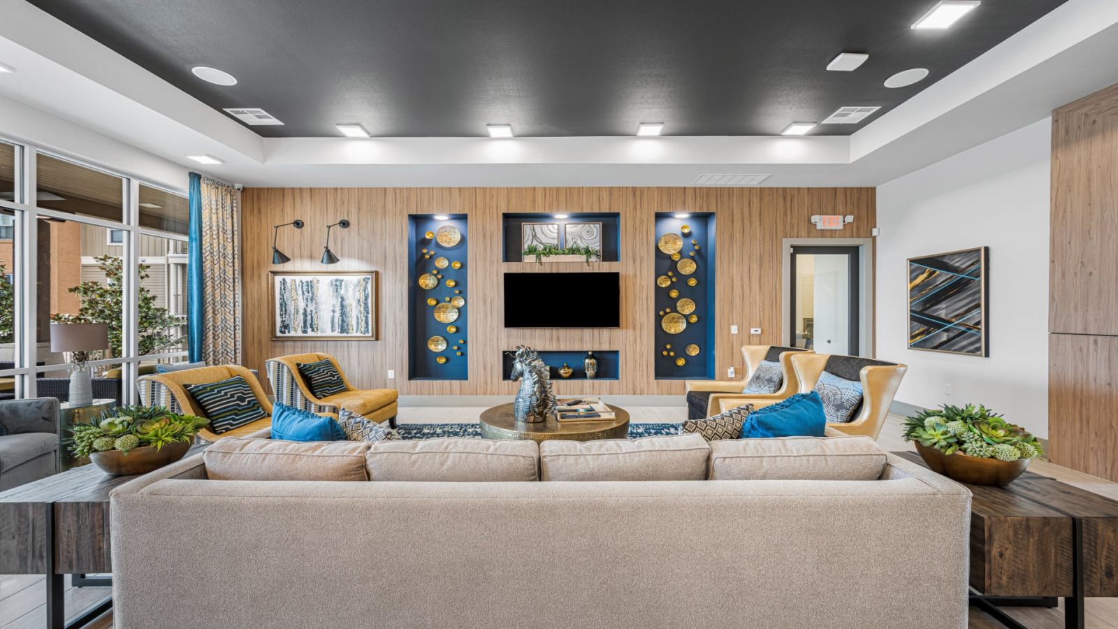 the living room features a large flat screen tv and a couch at The Panr Hollow