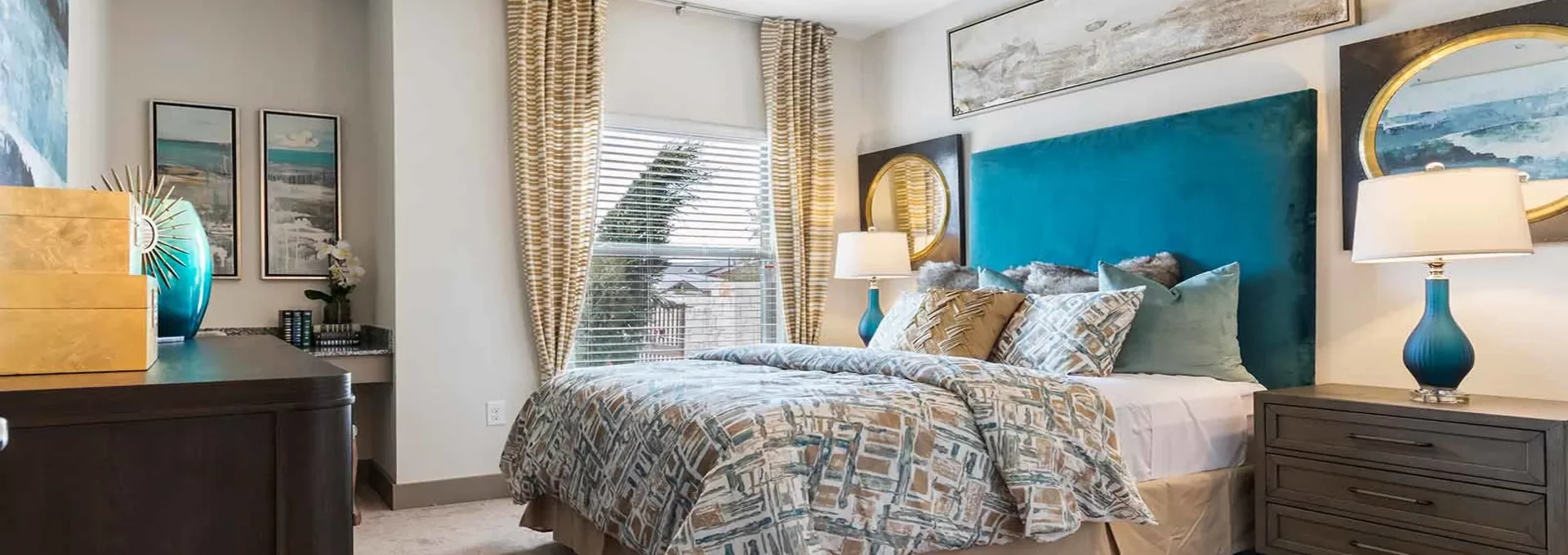 a bedroom with a blue headboard and ceiling fan at The Panr Hollow