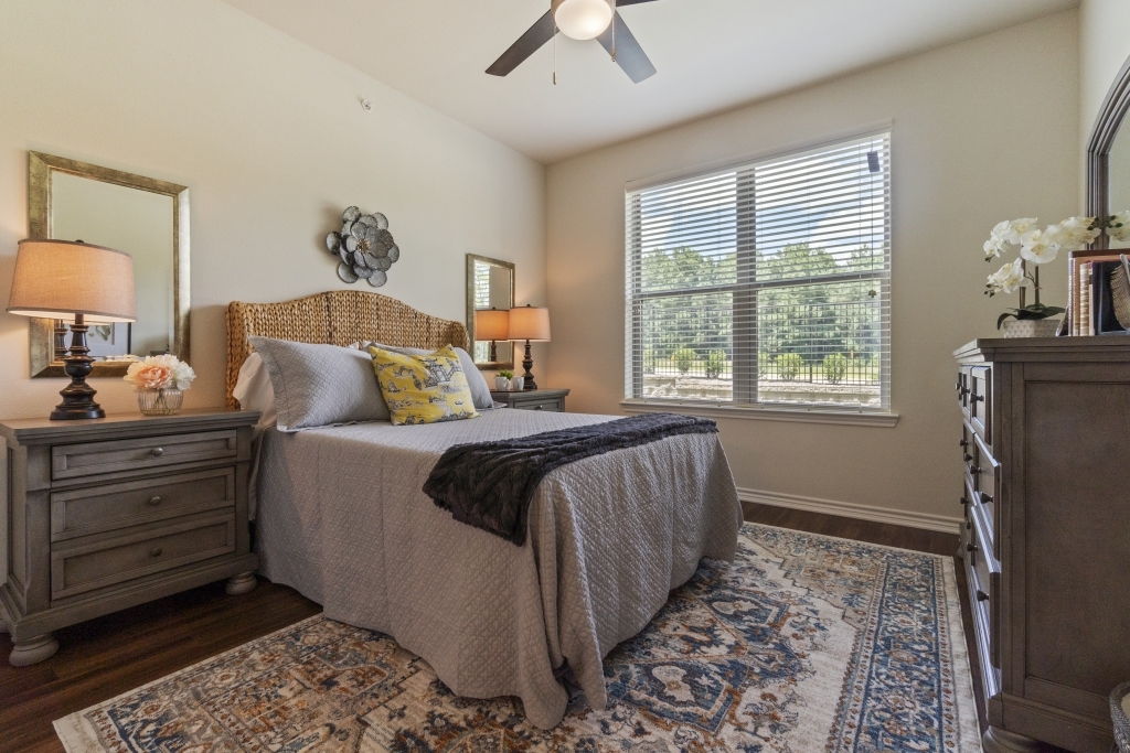 a bedroom with a bed, dresser and nightstand at The Panr Hollow